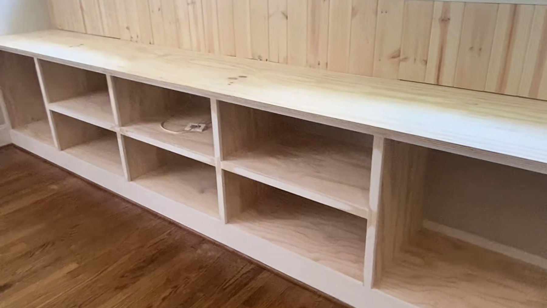 Gray Media Wall with Built-In Desk and Shelving